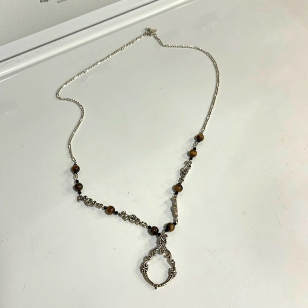Costume jewelry necklace can be used as a eyeglass holder